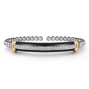 Gabriel & Co. BG5202E857MZJWS sterling silver and 14 karat yellow gold Bujukan bangle, front view of the black enamel bar with its stone row between two warmer toned end collars