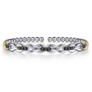 Gabriel & Co. BG5213-57MZJBS sterling silver and 14 karat yellow gold Bujukan bangle, front view of the oval link front with black stones and warm ring caps at each side