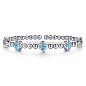 Gabriel & Co. BG5249-57SVJBT sterling silver Bujukan bangle, front view of the beaded open cuff with clover shaped blue stone clusters along the front