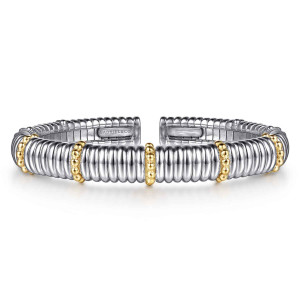 Gabriel & Co. BG5250-57MZJJJ sterling silver and 14 karat yellow gold Bujukan bangle, front view of a ridged cuff with a bead ring at the centre opposite the gap
