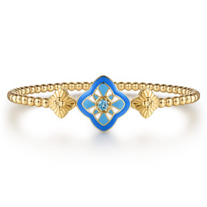 Gabriel & Co. BG5292EM57Y4JBT 14 karat yellow gold Bujukan bangle, front view of the blue enamel quatrefoil station with a small round stone between fluted plates