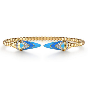 Gabriel & Co. BG5294EM57Y45JJ 14 karat yellow gold Bujukan bangle, front view of the two blue enamel spear tips with V shaped diamond pave