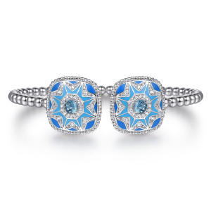 Gabriel & Co. BG5298EM57SVJMC sterling silver Bujukan bangle, front view of two facing caps with blue enamel stars, round blue stones and colorless halos