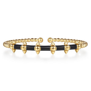 Gabriel & Co. BG5319E857Y4JJJ 14 karat yellow gold Bujukan bangle, front view of the round balls with pointed cones on each edge joined by black enamel