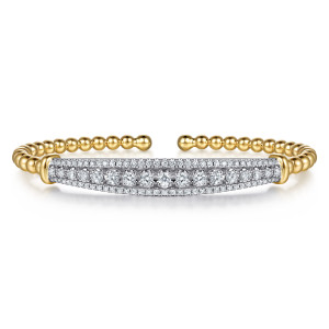 Gabriel & Co. BG5344-57M45JJ 14 karat white and yellow gold Bujukan bangle, front view of the diamond bar, larger round diamonds in the middle framed by tiny edge stones