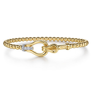 Gabriel & Co. BG5349-57Y45JJ 14 karat yellow gold Bujukan bangle, front view of the large smooth loop hooked through a smaller loop beside a diamond bar