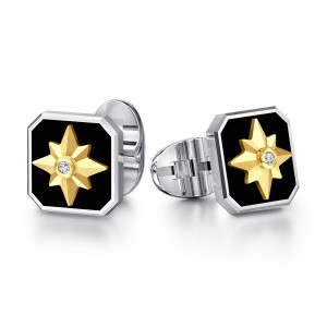 Gabriel & Co. CL20163MZ5OX sterling silver and 14 karat yellow gold Polaris men's cufflinks, angled view of the pair showing the faceted star on black and the jointed back fitting