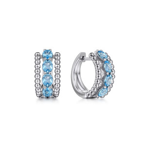 Gabriel & Co. EG14691SVJBT sterling silver Bujukan earrings, front view of two huggies with a blue stone row between borders of metal beads