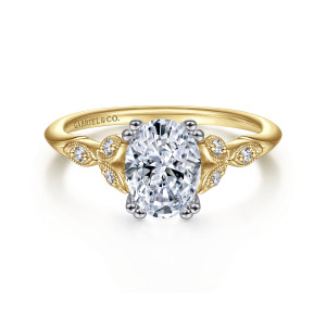Gabriel & Co. ER11721O4M44JJ 14 karat white and yellow gold Victorian engagement ring, front view of an oval center with paired prongs and leaf shaped shoulders holding small diamonds