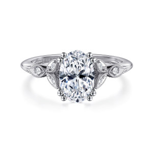 Gabriel & Co. ER11721O6W44JJ 14 karat white gold Victorian engagement ring, front view of leaf frames with small round diamonds spreading from both sides of an oval center
