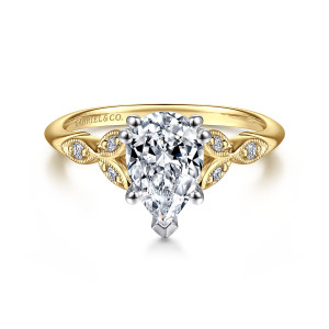 Gabriel & Co. ER11721P4M44JJ 14 karat white and yellow gold Victorian engagement ring, front view of a pear shaped center with a pointed tip prong and leaf frames at its sides