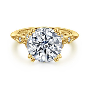 Gabriel & Co. ER11721R16Y44JJ 14 karat yellow gold Victorian engagement ring, front view of a round center with paired bead tipped prongs and leaf frames on both shoulders