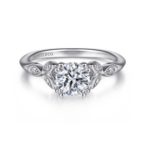 Gabriel & Co. ER11721R3W44JJ 14 karat white gold Victorian engagement ring, front view of a round center held by paired ball tipped prongs between leaf shaped clusters