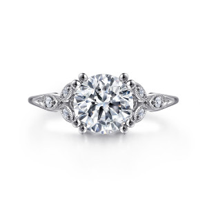 Gabriel & Co. ER11721R6W44JJ 14 karat white gold Victorian engagement ring, front view of a round center with paired ball tipped prongs and leaf motifs at each side