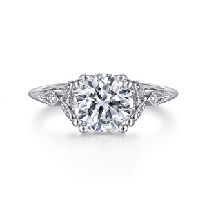 Gabriel & Co. ER11721R8W44JJ 14 karat white gold Victorian engagement ring, front view of a round center among paired ball tipped prongs and beaded leaf panels