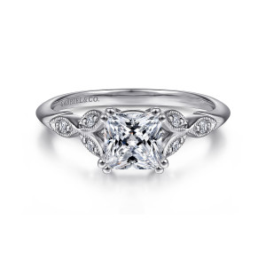 Gabriel & Co. ER11721S4W44JJ 14 karat white gold Victorian engagement ring, front view of a square princess cut center with beaded leaf motifs curling up each shoulder
