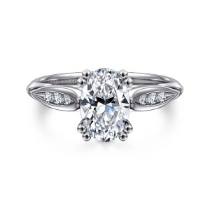 Gabriel & Co. ER11749O6W44JJ 14 karat white gold Contemporary engagement ring, front view of an oval center held by paired ball tipped prongs above leaf shaped channels