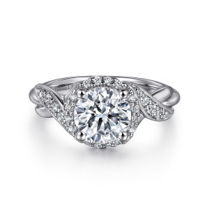 Gabriel & Co. ER11828R6W44JJ 14 karat white gold Victorian engagement ring, front view of a round center in a halo with crossing ribbons edged in fine beading