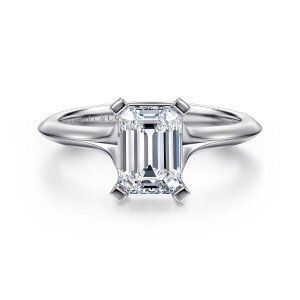 Gabriel & Co. ER11832E6W4JJJ 14 karat white gold Classic engagement ring, front view of an emerald cut center held by flat topped corner prongs above a tapering band