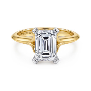 Gabriel & Co. ER11832E8M4JJJ 14 karat white and yellow gold Classic engagement ring, front view of an emerald cut center in squared corner prongs with the band narrowing to a ridge