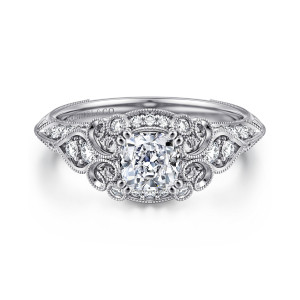 Gabriel & Co. ER11865C3W44JJ 14 karat white gold Contemporary engagement ring, front view of a cushion cut center framed by scrolls, beaded loops and small round bezel diamonds