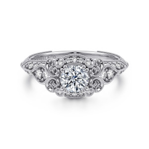 Gabriel & Co. ER11865R0W44JJ 14 karat white gold Victorian engagement ring, front view of a small round center inside scrolls with beaded arcs of diamonds