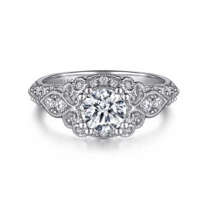 Gabriel & Co. ER11865R3W44JJ 14 karat white gold Victorian engagement ring, front view of a round center in a beaded frame with curled scrolls at each side