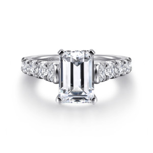 Gabriel & Co. ER12299E6W44JJ 14 karat white gold Classic engagement ring, front view of an emerald cut center with flat corner prongs and larger diamonds on each shoulder