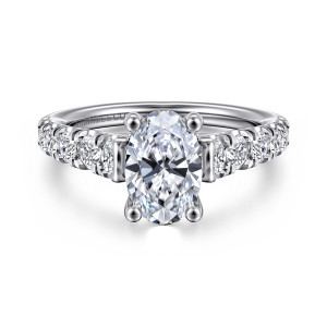 Gabriel & Co. ER12299O6W44JJ 14 karat white gold Classic engagement ring, front view of an oval center with four ball tipped prongs and diamond lined shoulders