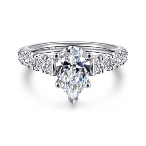 Gabriel & Co. ER12299P6W44JJ 14 karat white gold Classic engagement ring, front view of a pear shaped center with ball tipped prongs and a pointed prong at its tip