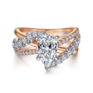 Gabriel & Co. ER12337P6T44JJ 14 karat white and rose gold Contemporary engagement ring, front view of the pear center with crossing strands of larger and finer stones on both tones