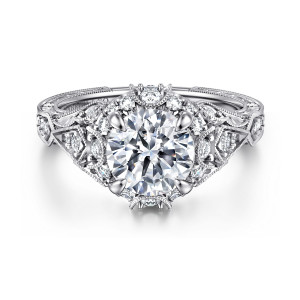Gabriel & Co. ER12579R6W44JJ 14 karat white gold Victorian engagement ring, front view of a round center ringed by small stones with beaded arches at either end