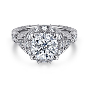 Gabriel & Co. ER12579R8W44JJ 14 karat white gold Victorian engagement ring, front view of a round center inside a diamond halo broken by small milgrain crescents