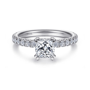Gabriel & Co. ER13904C4W44JJ 14 karat white gold Classic engagement ring, front view of a cushion cut center with paired claws at each corner and stones on both shoulders