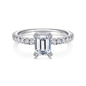 Gabriel & Co. ER13904E4W44JJ 14 karat white gold Classic engagement ring, front view of an emerald cut center with paired claws at each corner and diamond shoulders