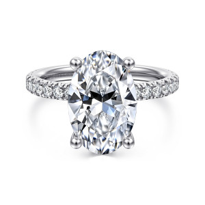 Gabriel & Co. ER13904O16W44JJ 14 karat white gold Classic engagement ring, front view of an oval center held by ball tipped prongs, with diamonds along both shoulders
