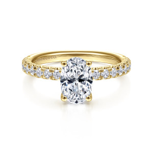 Gabriel & Co. ER13904O4Y44JJ 14 karat yellow gold Classic engagement ring, front view of an oval center on four rounded prongs with round diamonds along both shoulders