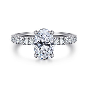 Gabriel & Co. ER13904O6W44JJ 14 karat white gold Classic engagement ring, front view of an oval center held by four ball-tipped prongs above a band of round diamonds