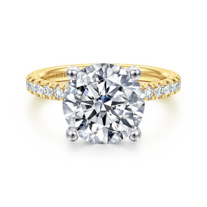 Gabriel & Co. ER13904R16M44JJ 14 karat white and yellow gold Classic engagement ring, front view of the round center held by four ball tipped prongs with diamonds on each shoulder