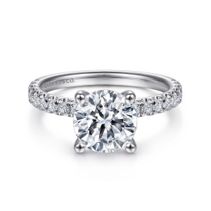 Gabriel & Co. ER13904R8W44JJ 14 karat white gold Classic engagement ring, front view of a round center on four ball tipped prongs with diamonds along each shoulder