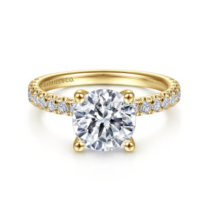 Gabriel & Co. ER13904R8Y44JJ 14 karat yellow gold Classic engagement ring, front view of a round center held by four ball tipped prongs above shoulders of small diamonds
