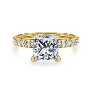 Gabriel & Co. ER13904S8Y44JJ 14 karat yellow gold Classic engagement ring, front view of a princess cut center in squared corner prongs with diamonds on both shoulders