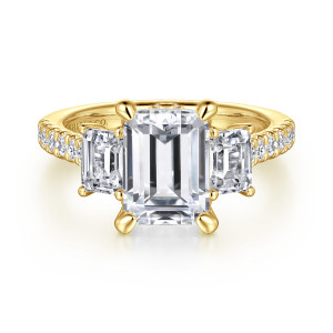 Gabriel & Co. ER14069E10Y44JJ 14 karat yellow gold Contemporary engagement ring, front view of an emerald cut center between two step cut side stones on a diamond set band