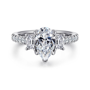 Gabriel & Co. ER14069P6W44JJ 14 karat white gold Contemporary engagement ring, front view of a pear shaped center flanked by two step cut stones and diamonds along the shoulders