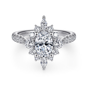 Gabriel & Co. ER14450O4W44JJ 14 karat white gold Starlight engagement ring, front view of a starburst halo with elongated tips above and below the oval center