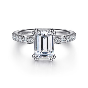 Gabriel & Co. ER14649E8W44JJ 14 karat white gold Classic engagement ring, front view of an emerald cut center in paired corner prongs above small diamonds along the band