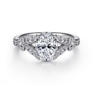 Gabriel & Co. ER14662O4W44JJ 14 karat white gold Victorian engagement ring, front view of the upright oval center flanked by leaf sprays and the split at each shoulder
