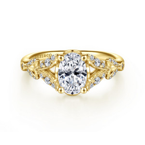 Gabriel & Co. ER14662O4Y44JJ 14 karat yellow gold Victorian engagement ring, front view of an upright oval center between split shoulders of milgrain edged leaves