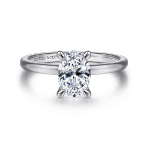 Gabriel & Co. ER14684O4W4JJJ 14 karat white gold Classic engagement ring, front view of an oval center held by four claws on a smooth rounded band