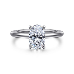 Gabriel & Co. ER14684O6W4JJJ 14 karat white gold Classic engagement ring, front view of an oval center set lengthwise between slender prongs on a smooth band
